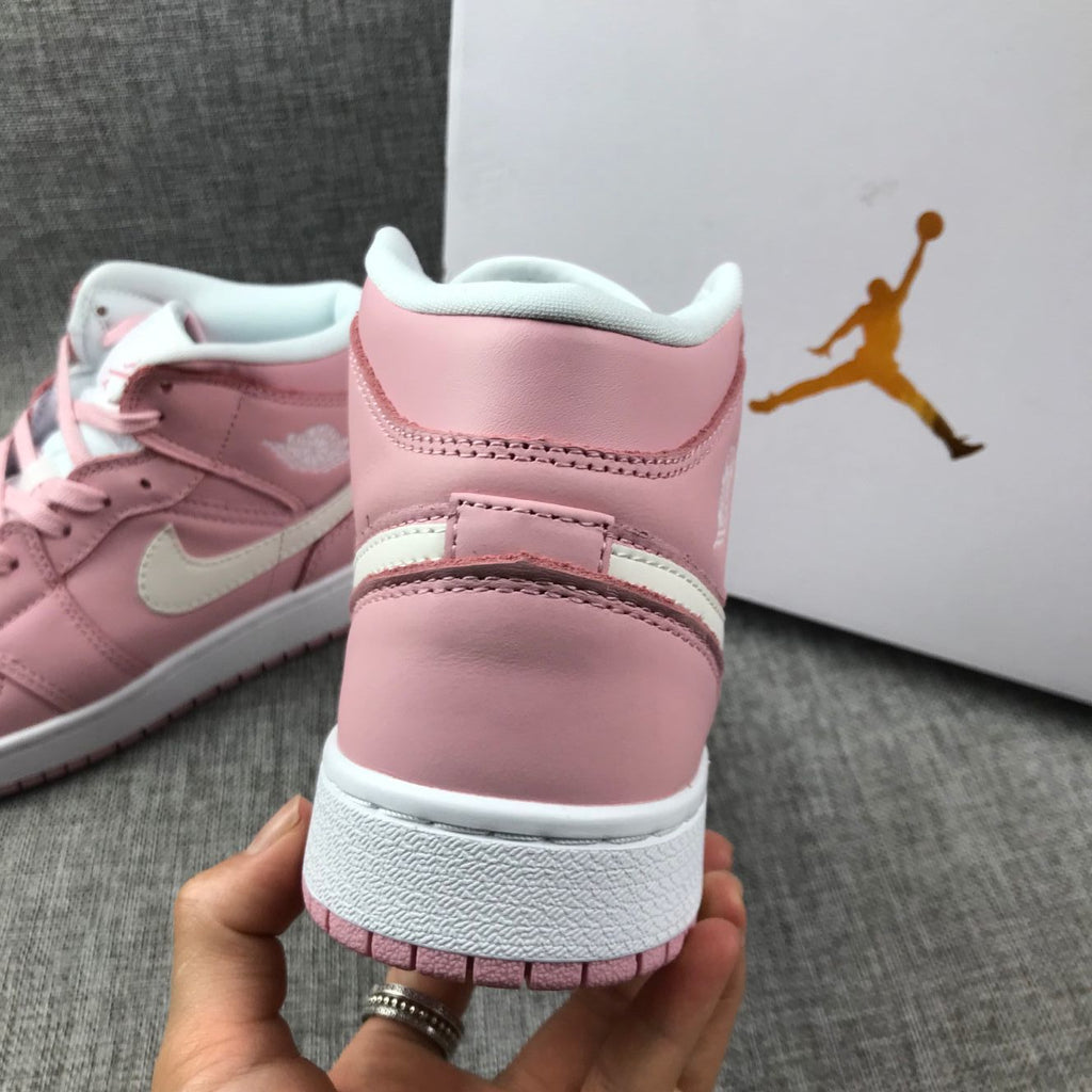 Women's Jordan 1 Mid Pink Sneakers 555112-100 - product image from the listing.