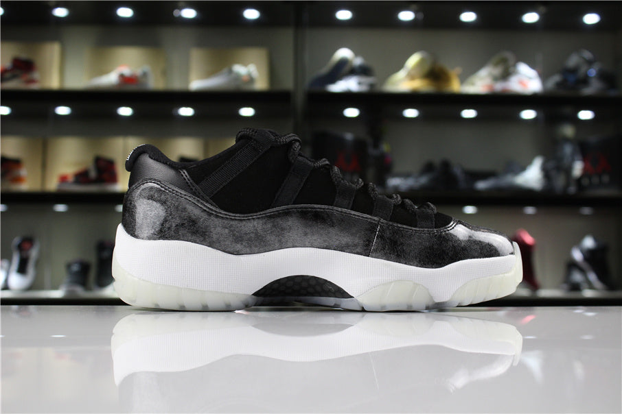 Jordan 11 Retro Low Barons Sneakers in Black White - product image from the listing.