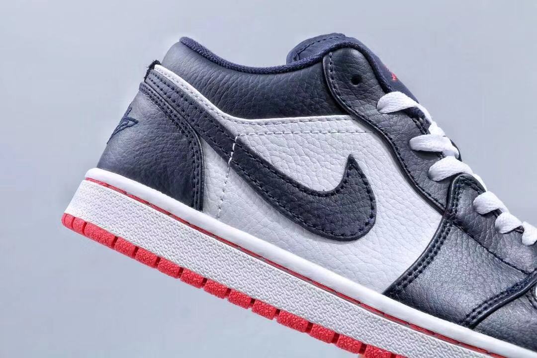 Jordan 1 Low Sneakers in Midnight Navy White Red - product image from the listing.
