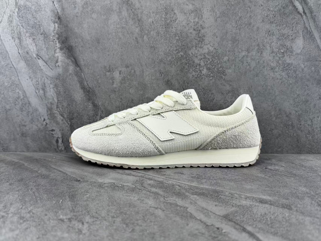 Cream and Light Gray New Balance Low-Top Sneakers - product image from the listing.