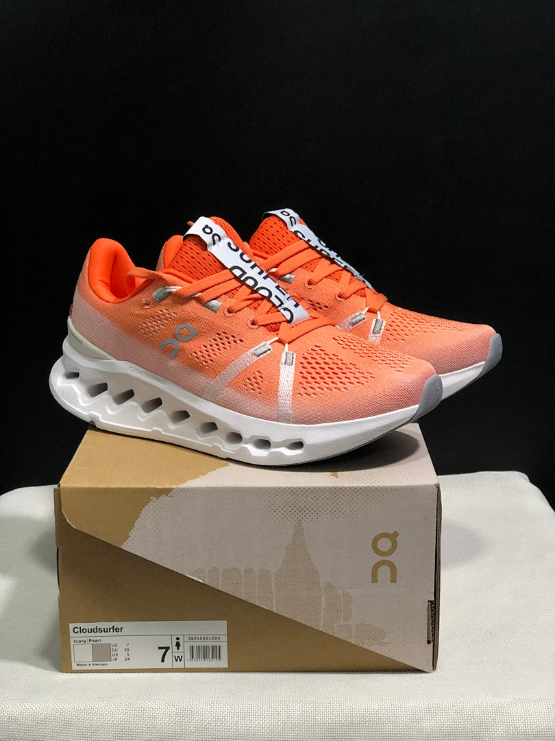 Coral and White On Cloudsurfer Running Shoes - product image from the listing.