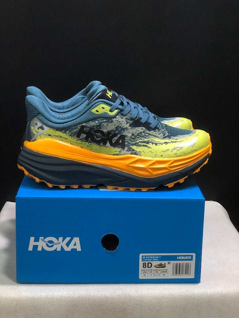 HOKA Stinson 7 Trail Running Shoes in Blue Yellow Orange - product image from the listing.