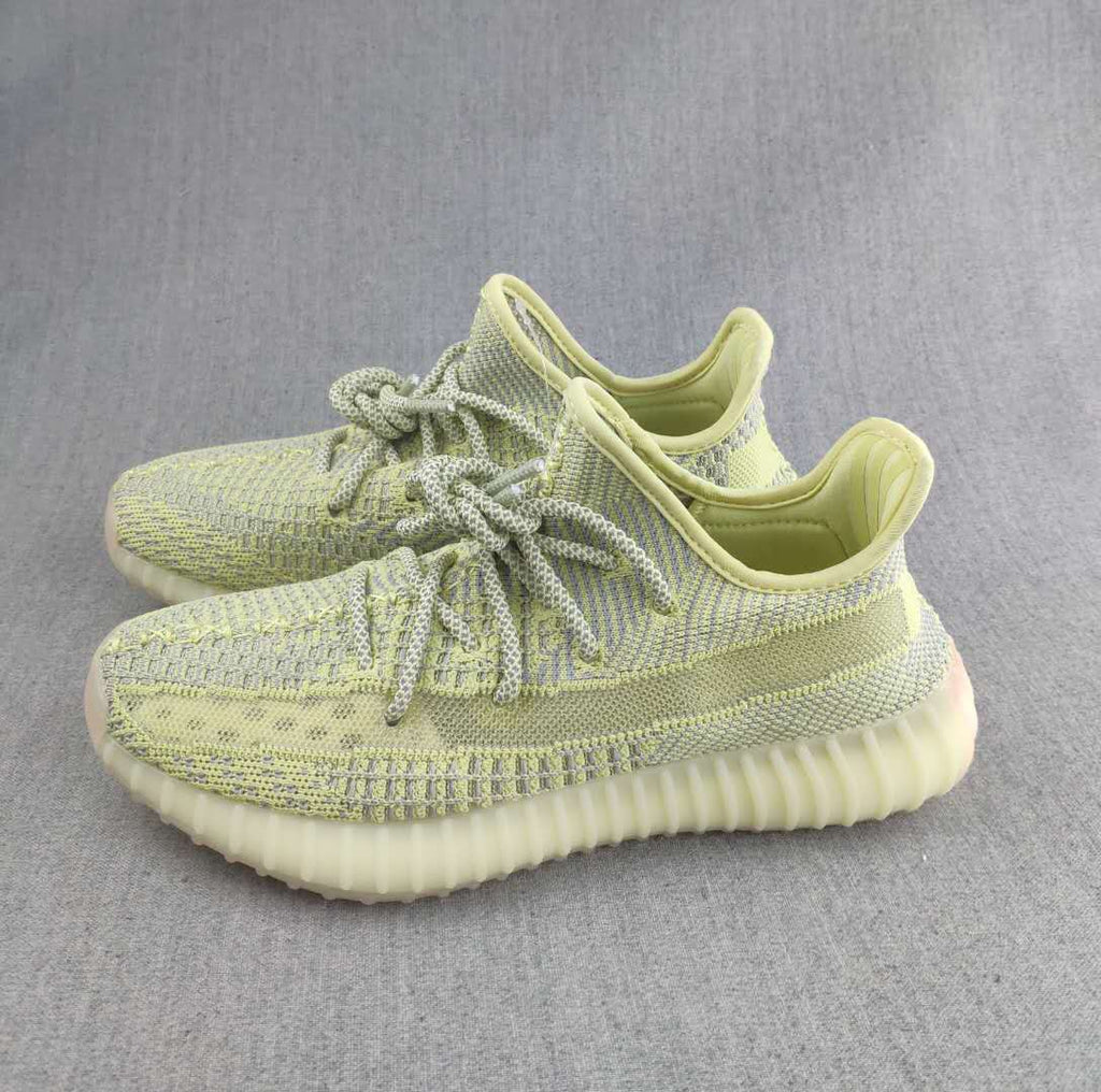 Pale Yellow and Gray Yeezy 350 V2 Knit Sneakers - product image from the listing.