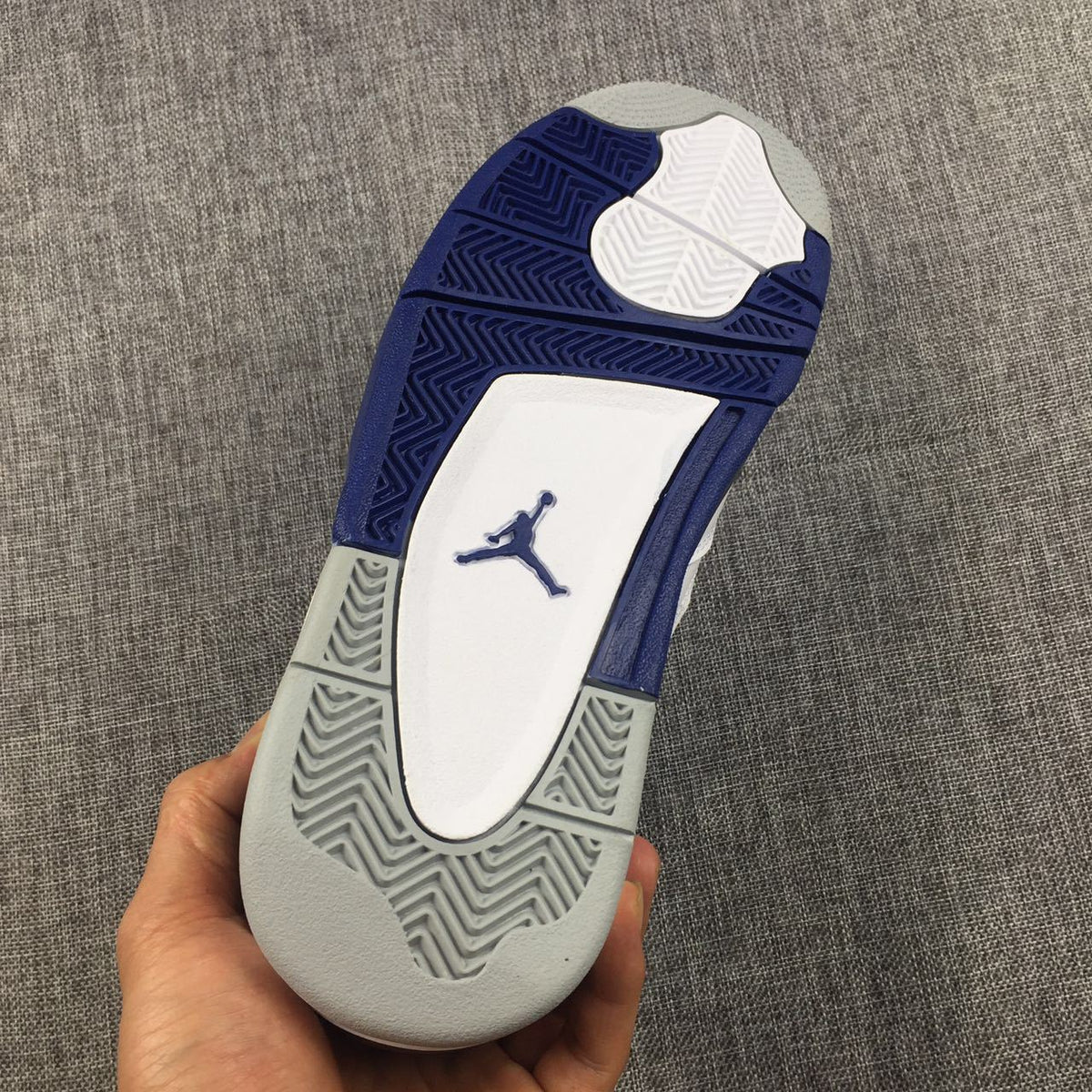 Air Jordan 4 Sneakers in White, Black and Blue - product image from the listing.