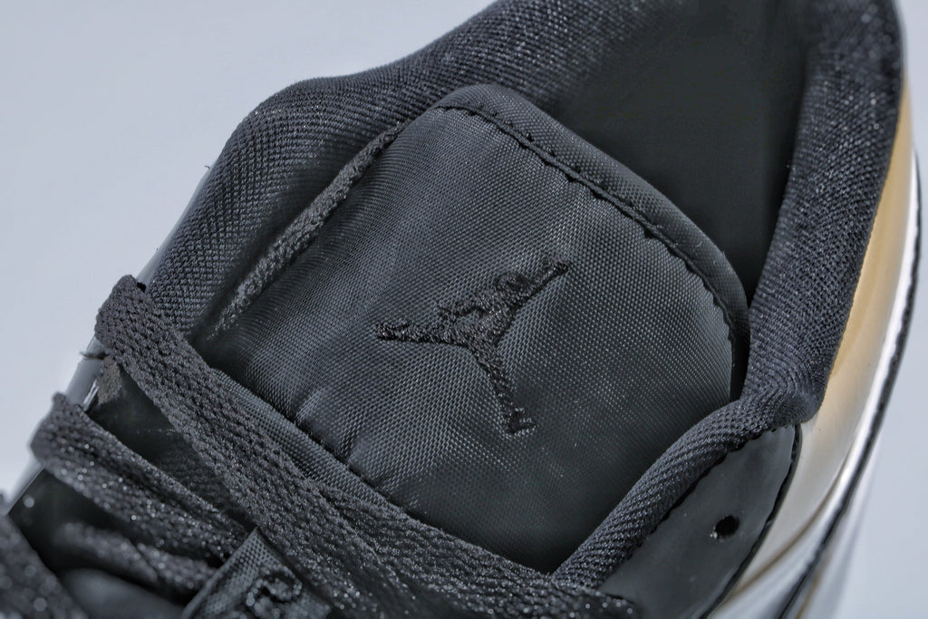 Jordan 1 Low Gold Toe Sneakers in Black and Metallic Gold - product image from the listing.