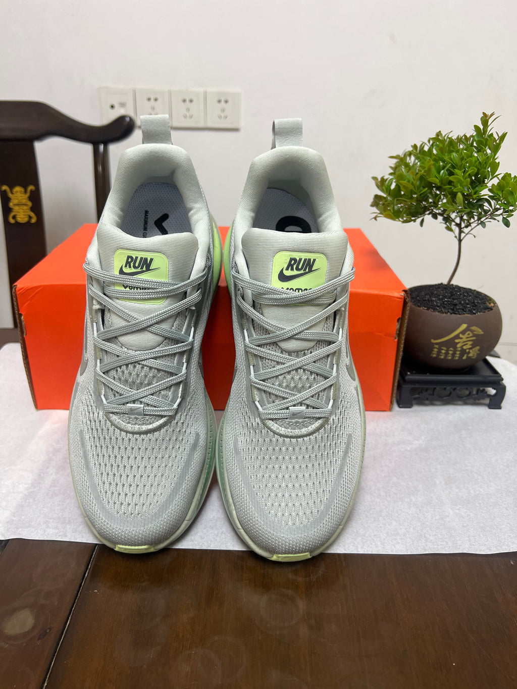 Nike Vomero 18 Running Shoes, in Gray and Volt - product image from the listing.