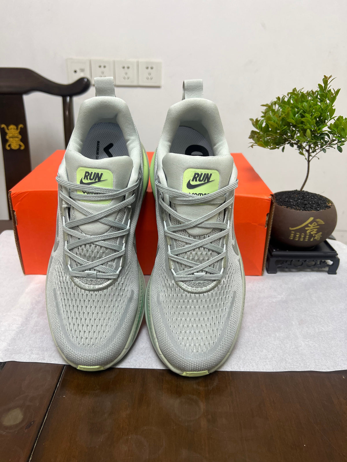 Nike Vomero 18 Running Shoes, in Gray and Volt - product image from the listing.