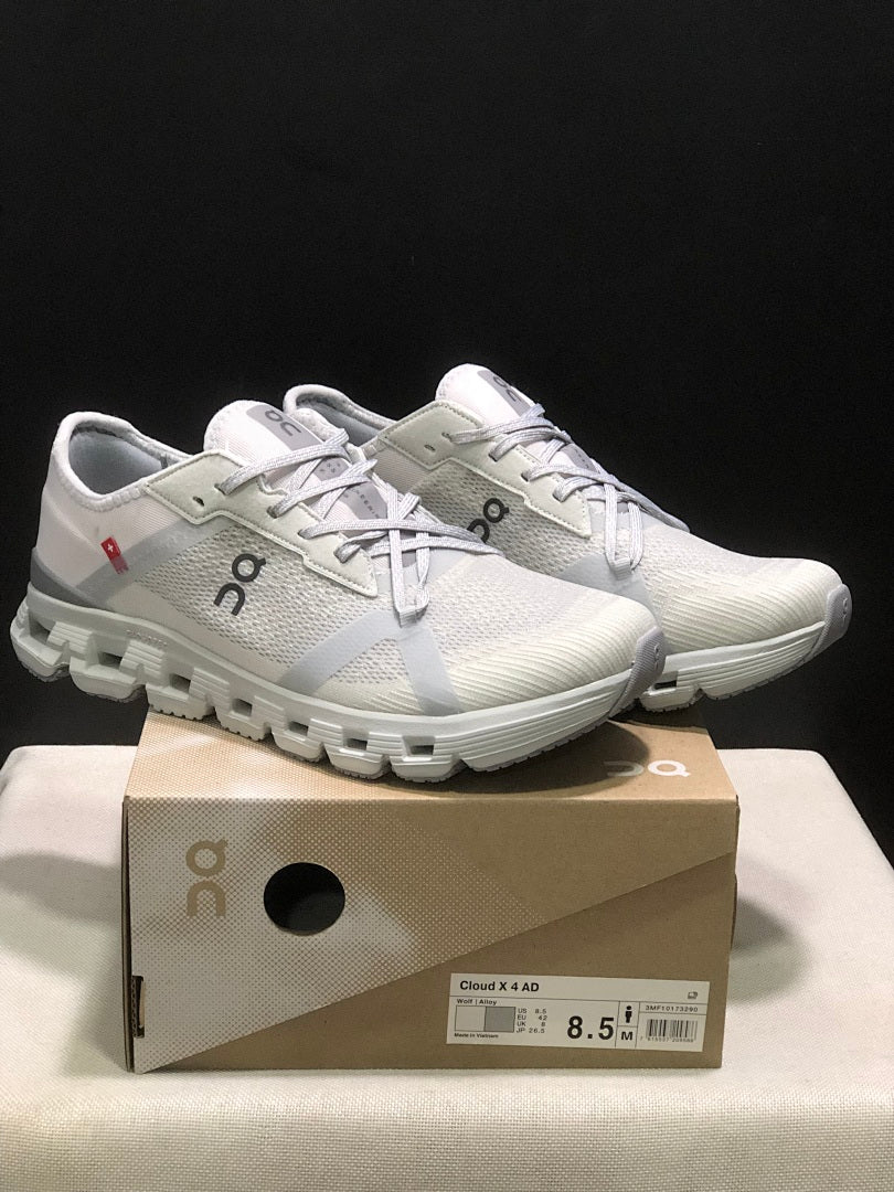 On Cloud X 4 AD Sneakers in Wolf/Alloy in Light Gray - product image from the listing.