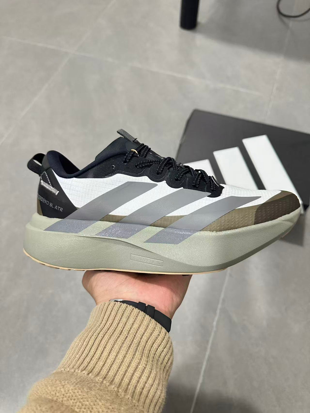 Black and White Adidas Adizero SL Running Shoes - product image from the listing.