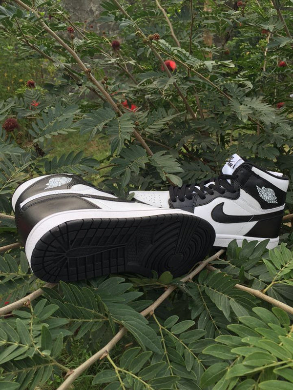 Jordan 1 High Sneakers in Black and White - product image from the listing.