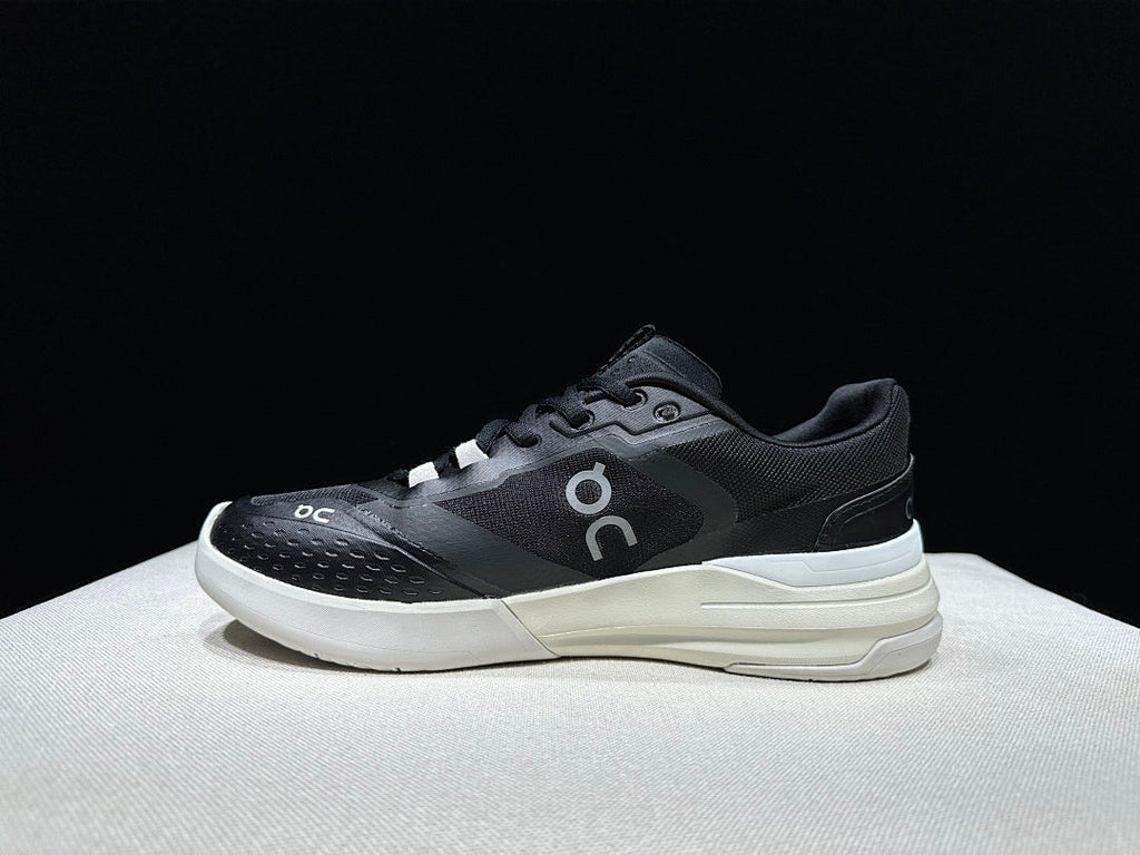 On THE ROGER Clubhouse Pro Tennis Sneakers in Black and White - product image from the listing.