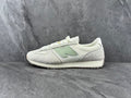 Cream and Light Gray New Balance Low-Top Sneakers - product image from the listing.