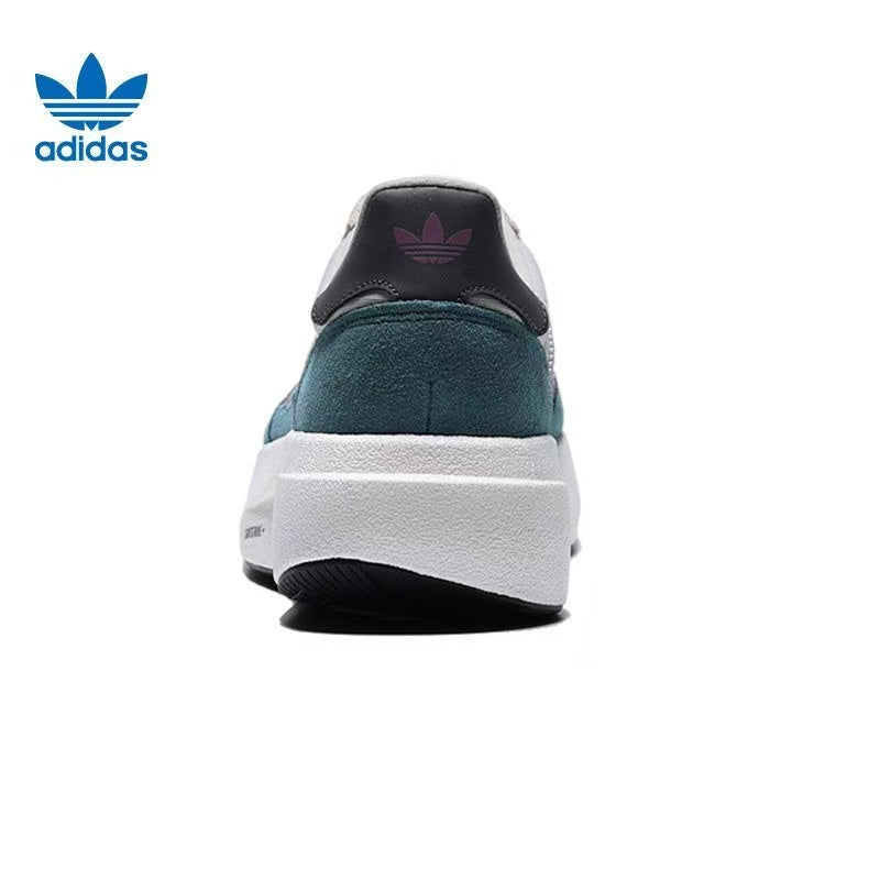 Adidas White and Green Platform Trainers with Mauve Stripes - product image from the listing.