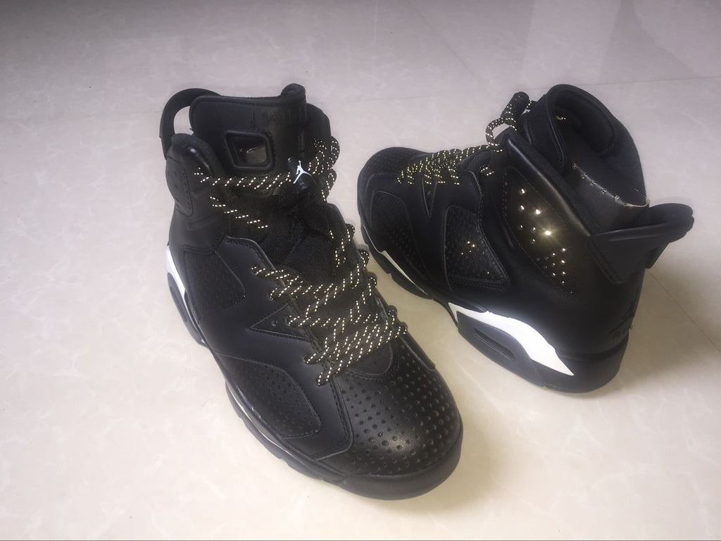 Jordan 6 Retro Black Cat High-Top Sneakers in Black and White - product image from the listing.