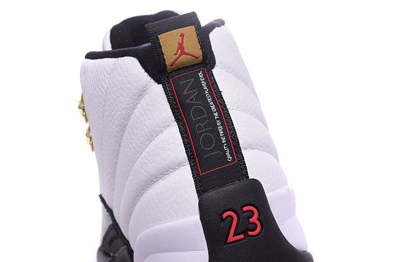 Air Jordan 12 Retro White and Black High-Top Sneakers - product image from the listing.