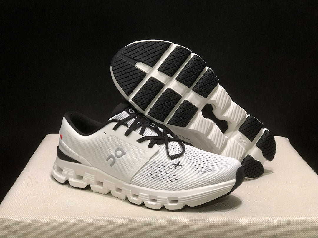 On Cloud X 4 Sneakers in Ivory and Black - product image from the listing.
