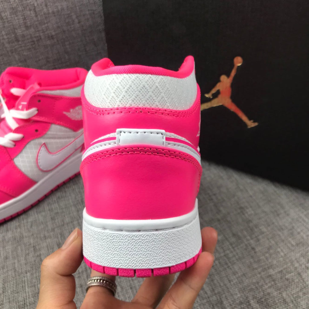 Air Jordan 1 Mid Sneakers in White Pink 555112-611 - product image from the listing.