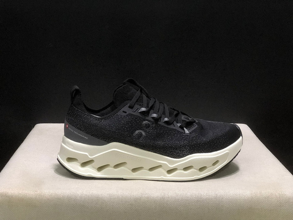 On Cloudsurfer Max Running Sneakers in Black and White - product image from the listing.