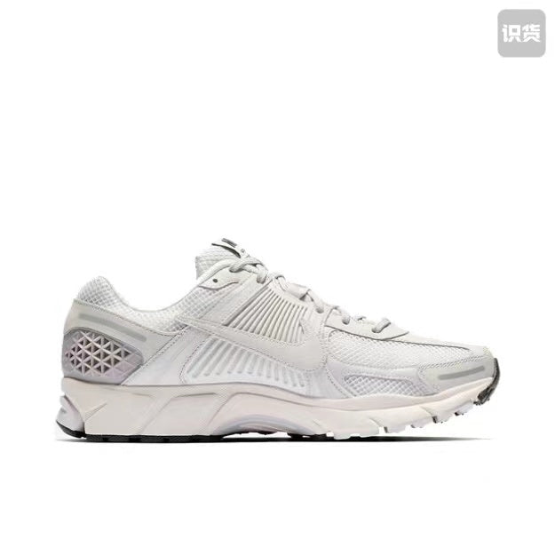 Nike Zoom Vomero 5 Sneakers in Grey and White - product image from the listing.