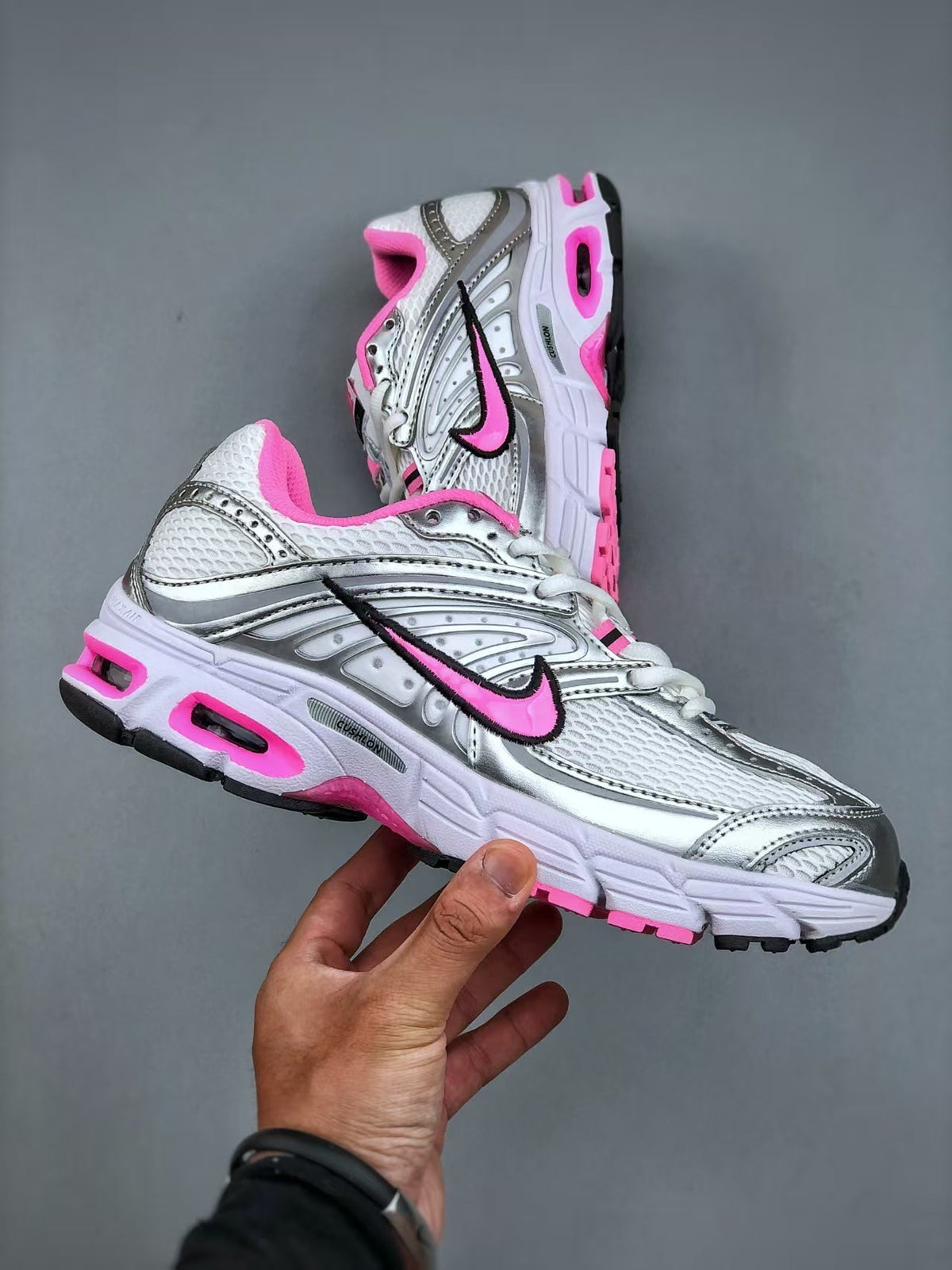 Nike Air Max Moto 2K Low-Top Running Shoes in White Pink - product image from the listing.