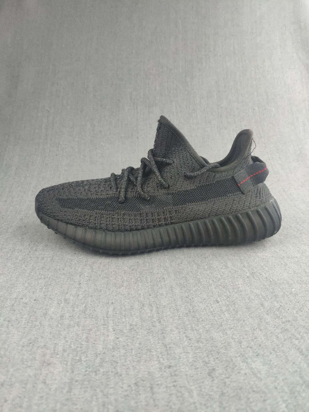 Yeezy Boost 350 V2 Sneakers in Dark Gray Knit - product image from the listing.