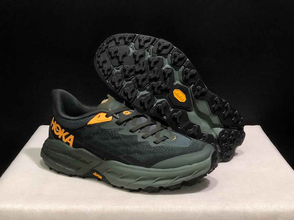 HOKA Speedgoat 5 Trail Running Shoes, in Black and Olive - product image from the listing.