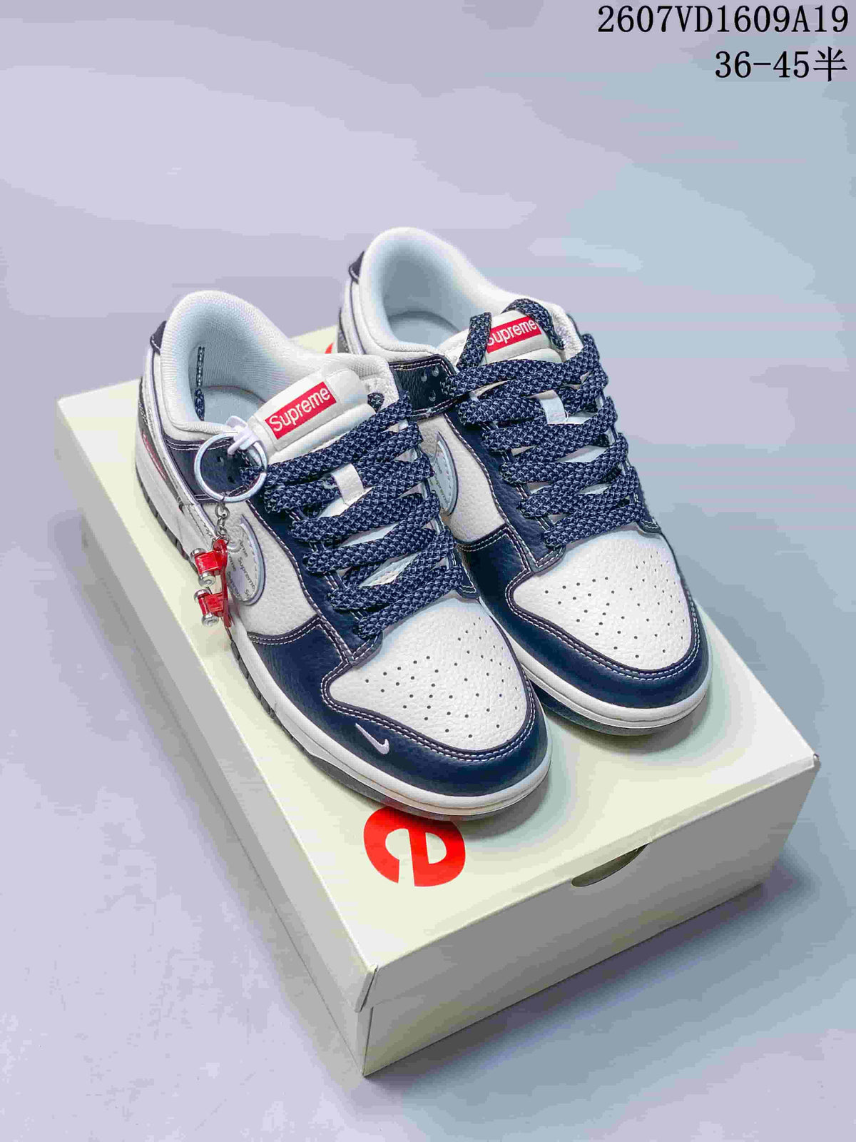 Nike Dunk Low Retro Custom Sneakers in White and Navy - product image from the listing.