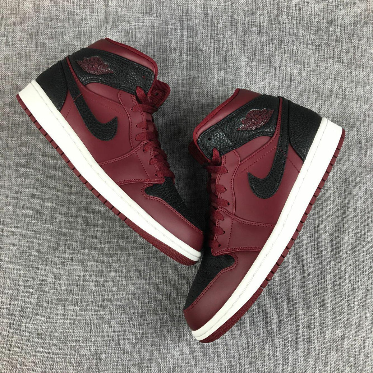 Air Jordan 1 Mid Sneakers in Black and Burgundy 554724-601 - product image from the listing.