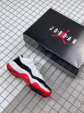 Air Jordan 11 Win Like '82 Sneakers in White Black Red - product image from the listing.