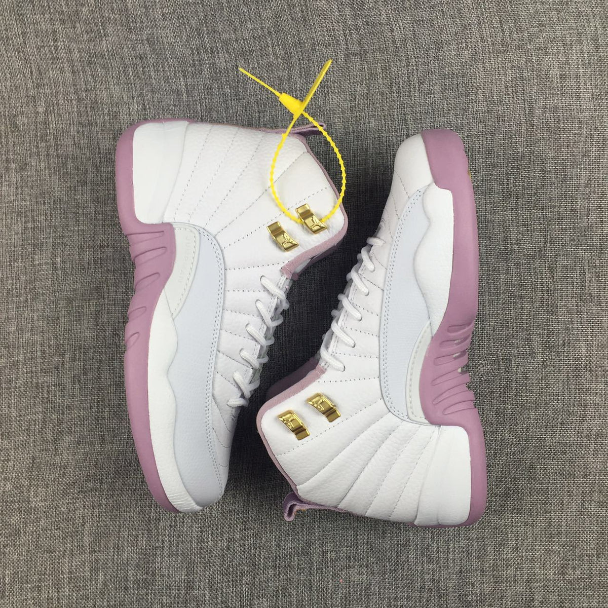 Air Jordan 12 Cherry Blossom Pink Sneakers - product image from the listing.