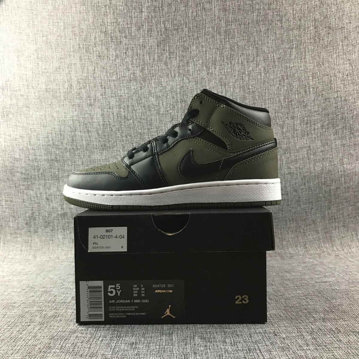 Black and Olive Green Jordan 1 Mid Sneakers - product image from the listing.
