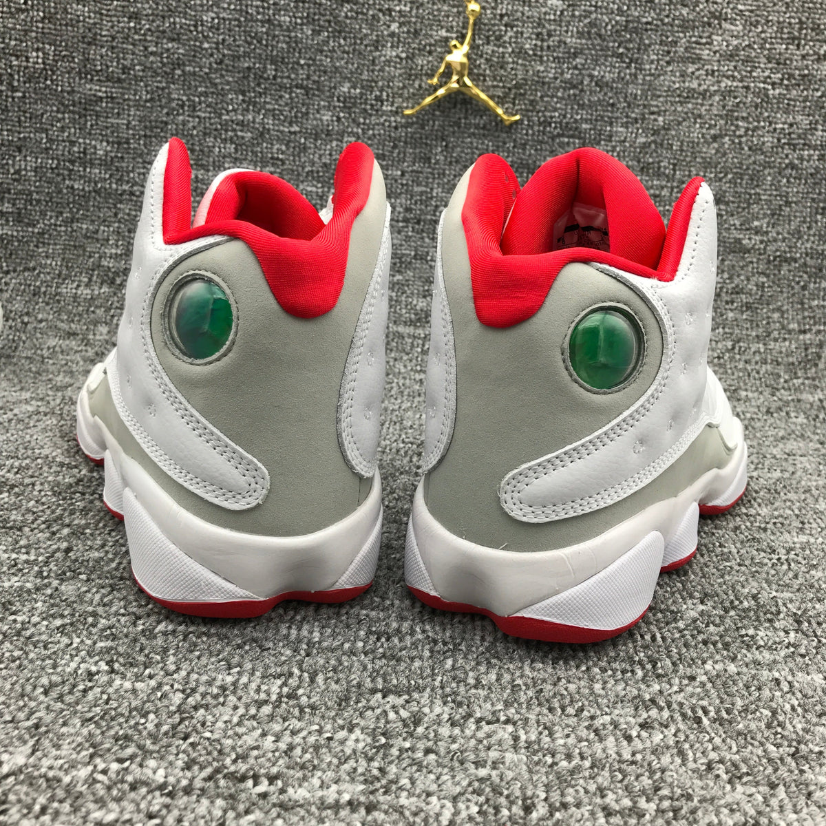 Air Jordan 13 High-Top Sneakers in White and Red - product image from the listing.