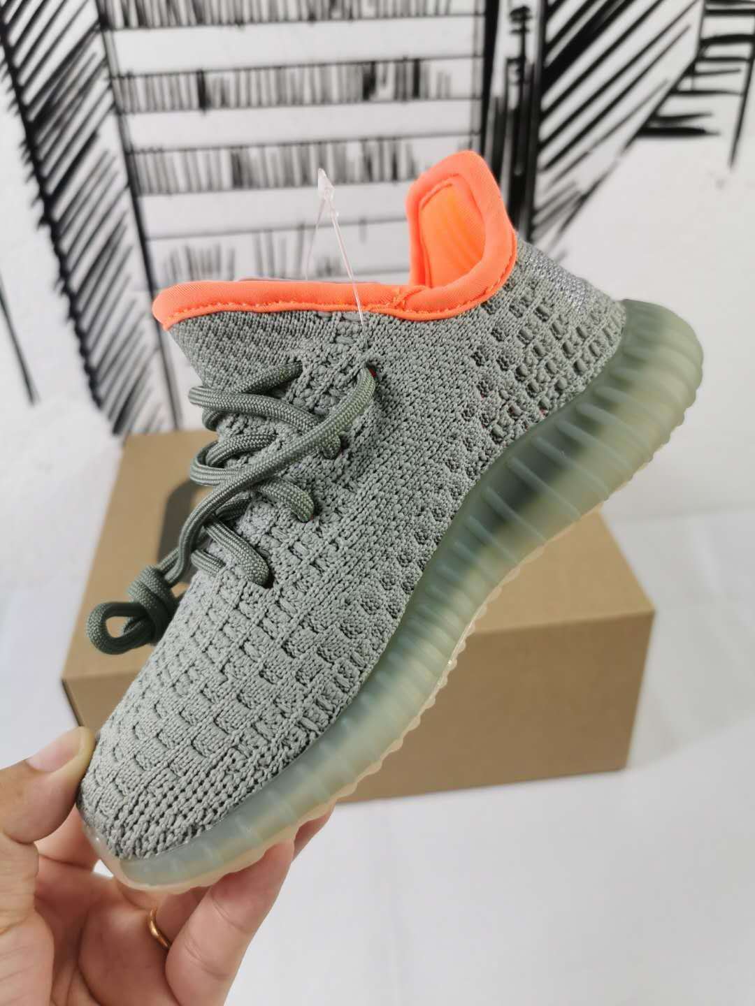 Grey and Orange Yeezy 350 V2 Kids Sneakers - product image from the listing.