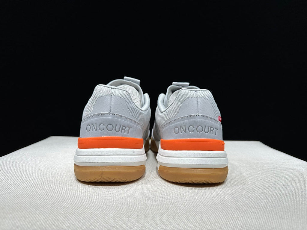 On THE ROGER Advantage Pro Tennis Shoes, in Grey and Orange - product image from the listing.