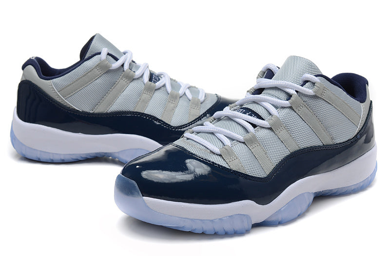 Air Jordan 11 Retro Low Sneakers, White and Navy - product image from the listing.