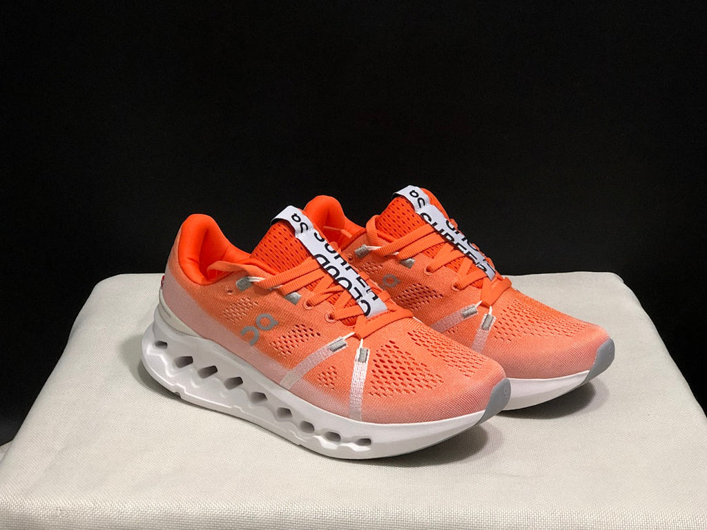 Coral and White On Cloudsurfer Running Shoes - product image from the listing.