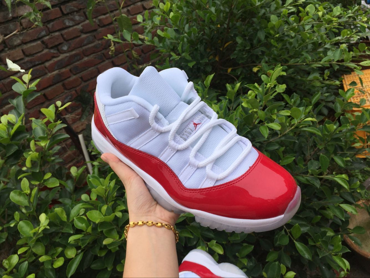 Air Jordan 11 Low Sneakers White Red - product image from the listing.