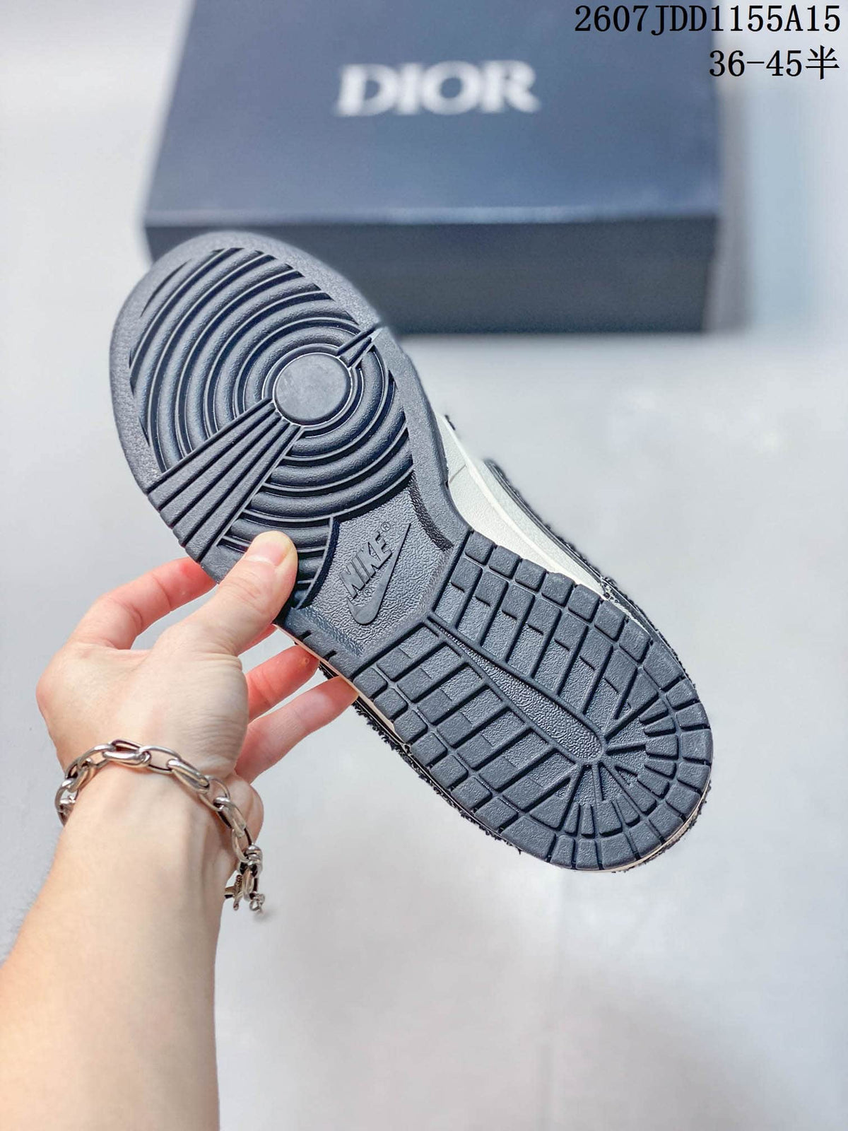 Nike SB Dunk Low White Navy Dior Pattern Trainers - product image from the listing.