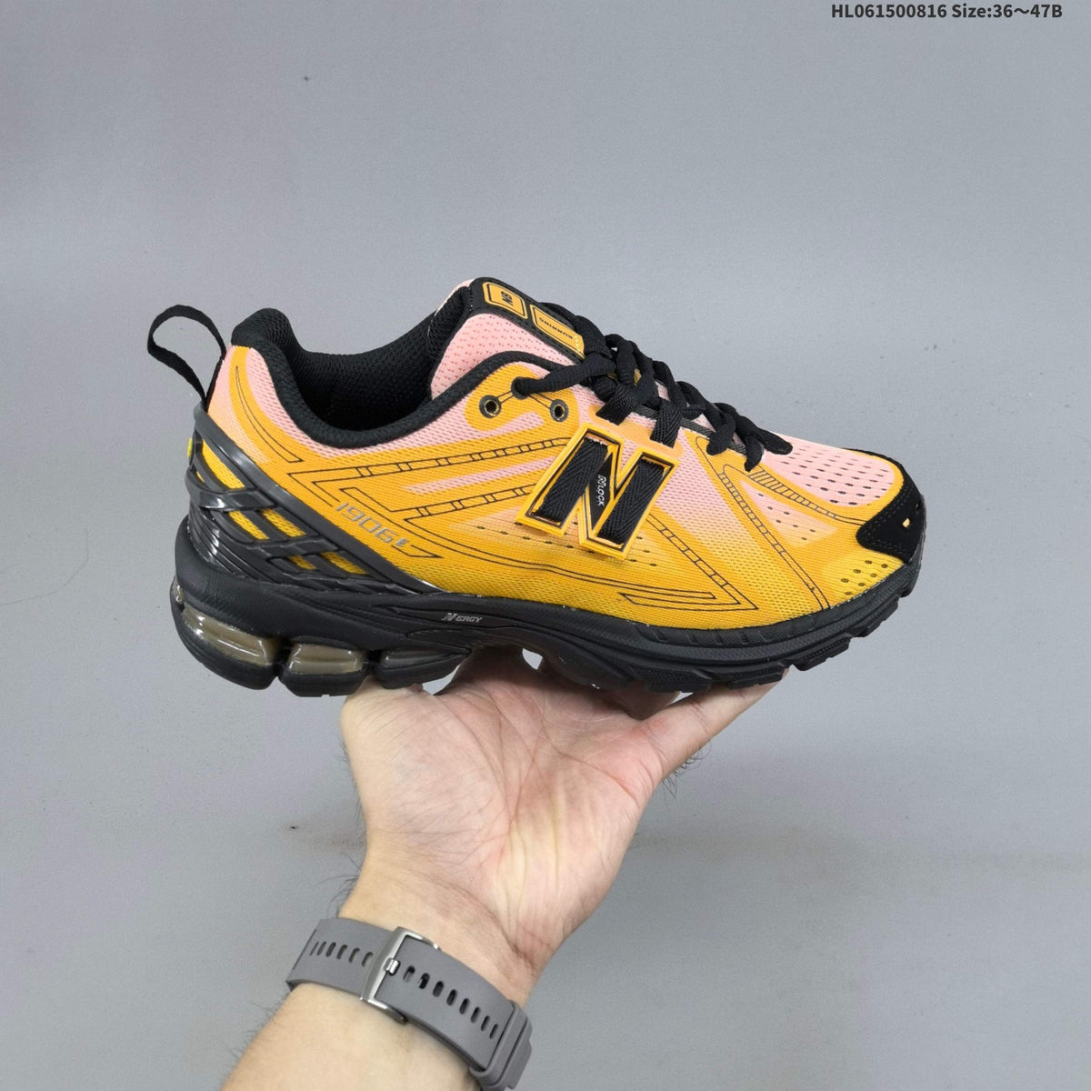 New Balance M1906R Sneakers in Pink Yellow Black U1906596 - product image from the listing.