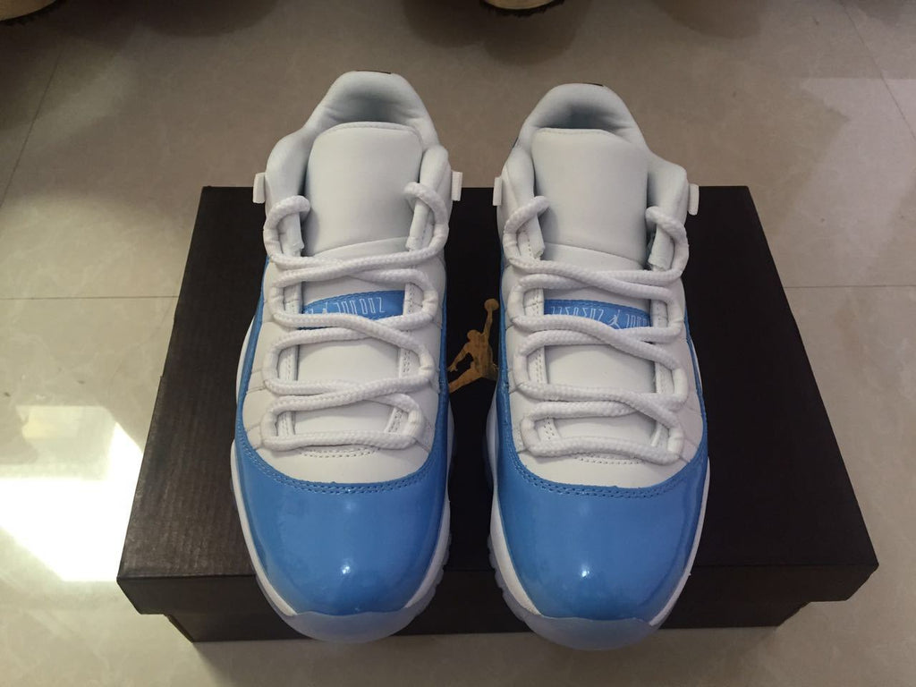 White and University Blue Jordan 11 Low Sneakers - product image from the listing.