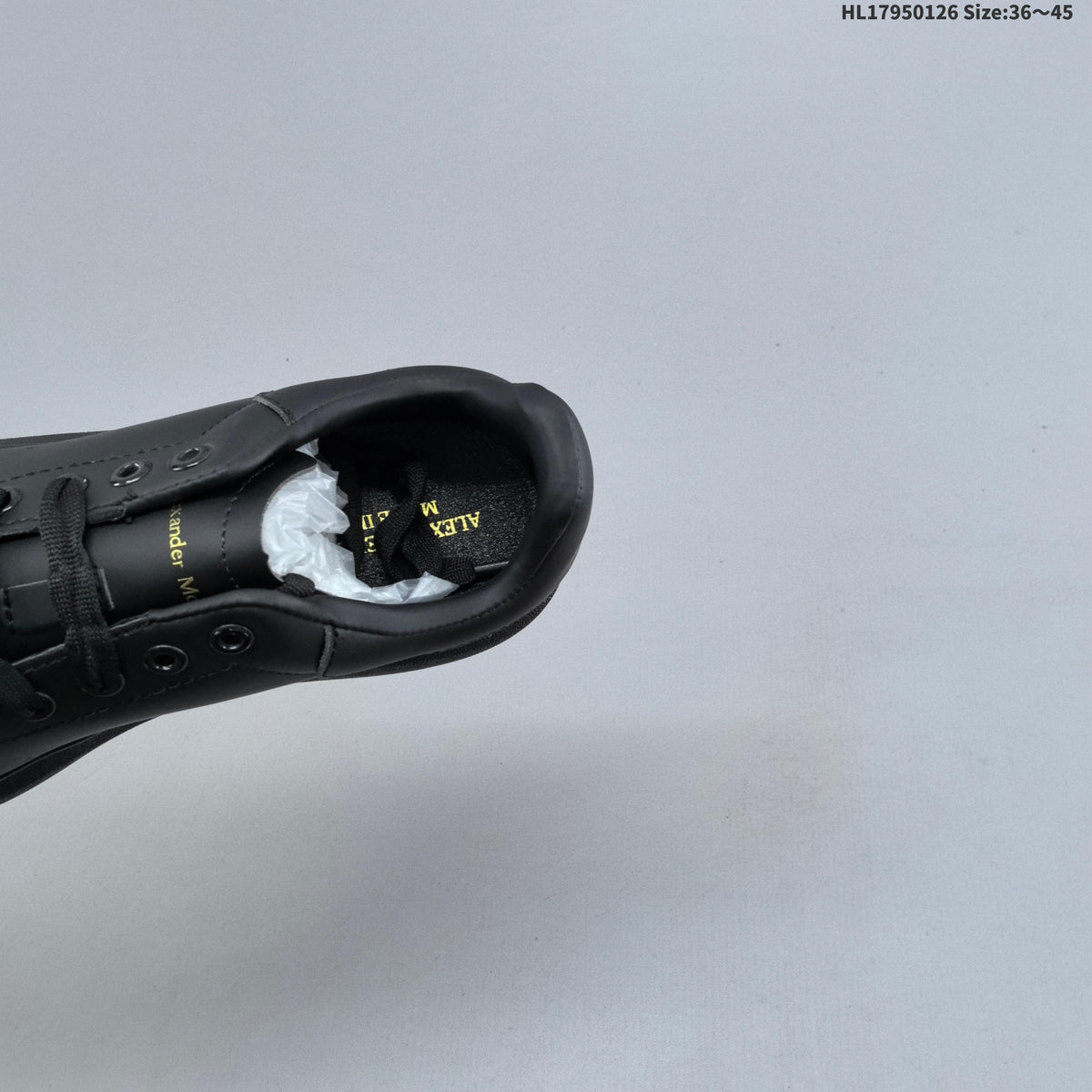 Alexander McQueen Low-Cut Sneakers in Black with Thick Sole - product image from the listing.