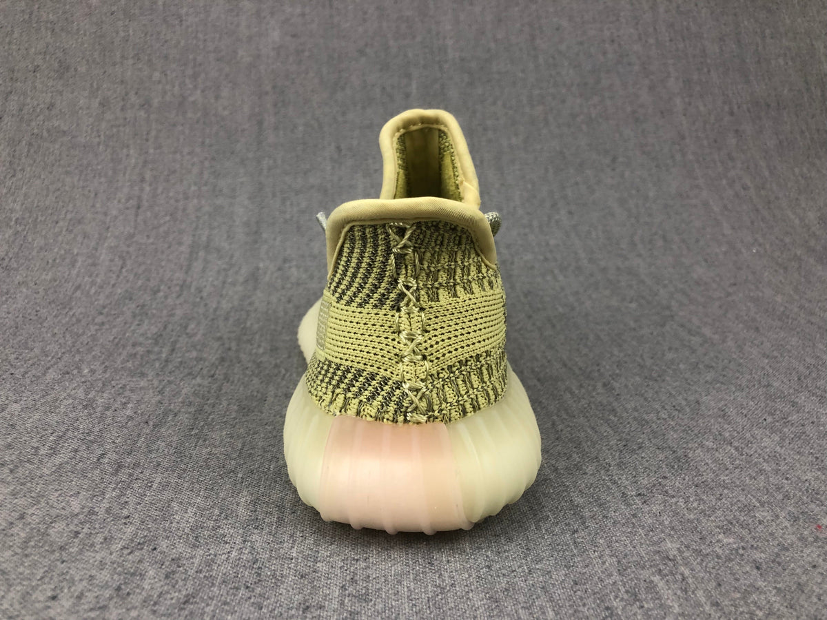 Yellow and Olive Yeezy 350 V2 Kids Sneakers - product image from the listing.