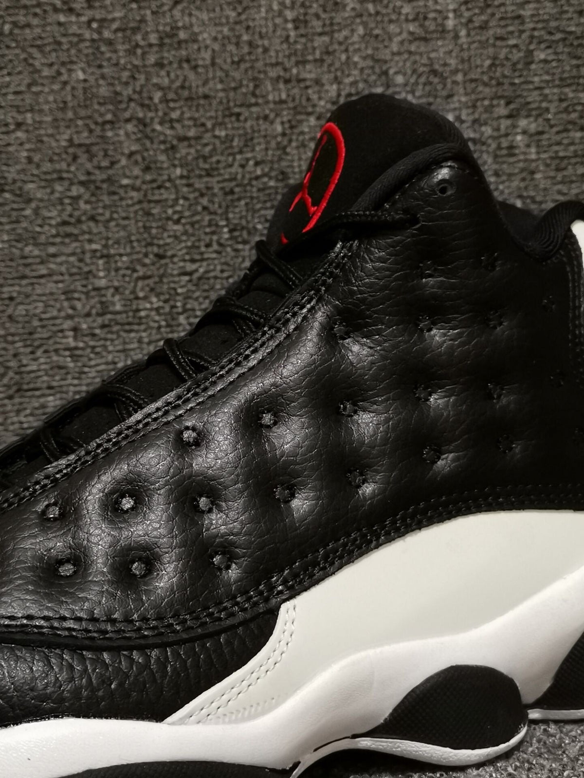 Air Jordan 13 Retro Black Red White Sneakers - product image from the listing.