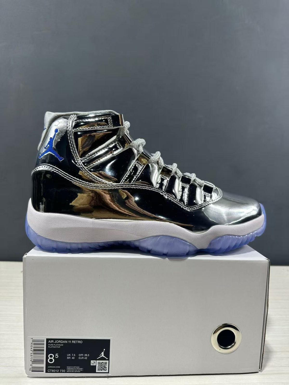 Air Jordan 11 Retro Liquid Silver High-Top Sneakers - product image from the listing.