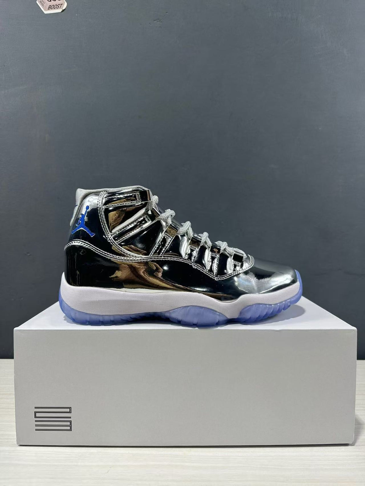 Air Jordan 11 Retro Liquid Silver High-Top Sneakers - product image from the listing.