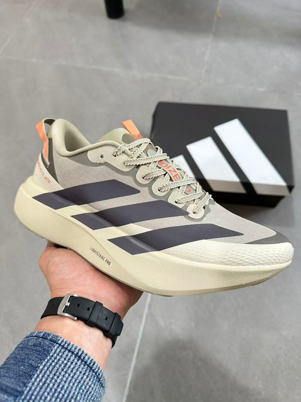 Adidas Adizero Lightstrike Pro Running Shoes, in Cream and Navy - product image from the listing.