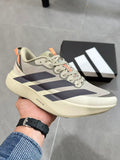 Adidas Adizero Lightstrike Pro Running Shoes, in Cream and Navy - product image from the listing.