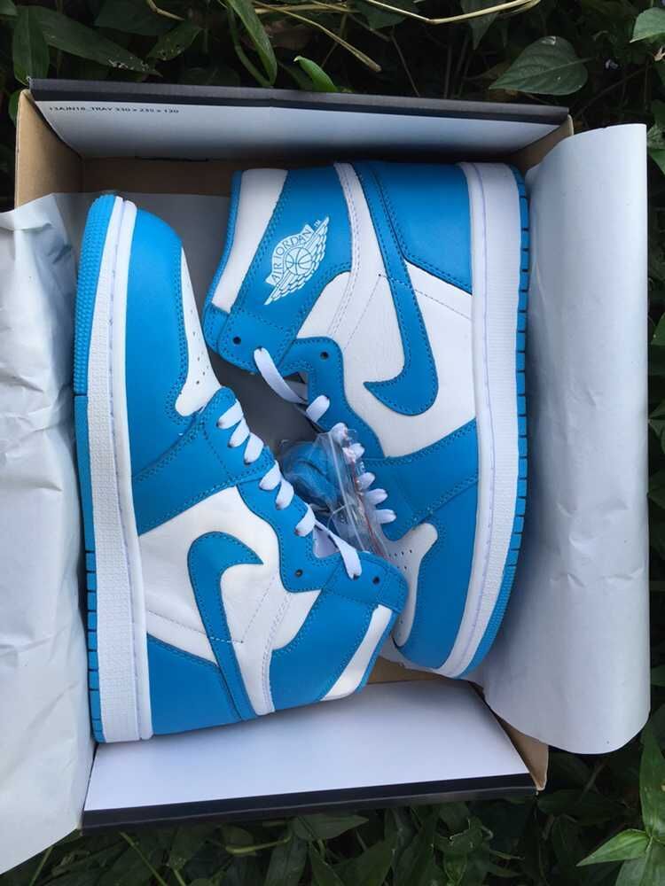 Blue and White Air Jordan 1 High Sneakers - product image from the listing.