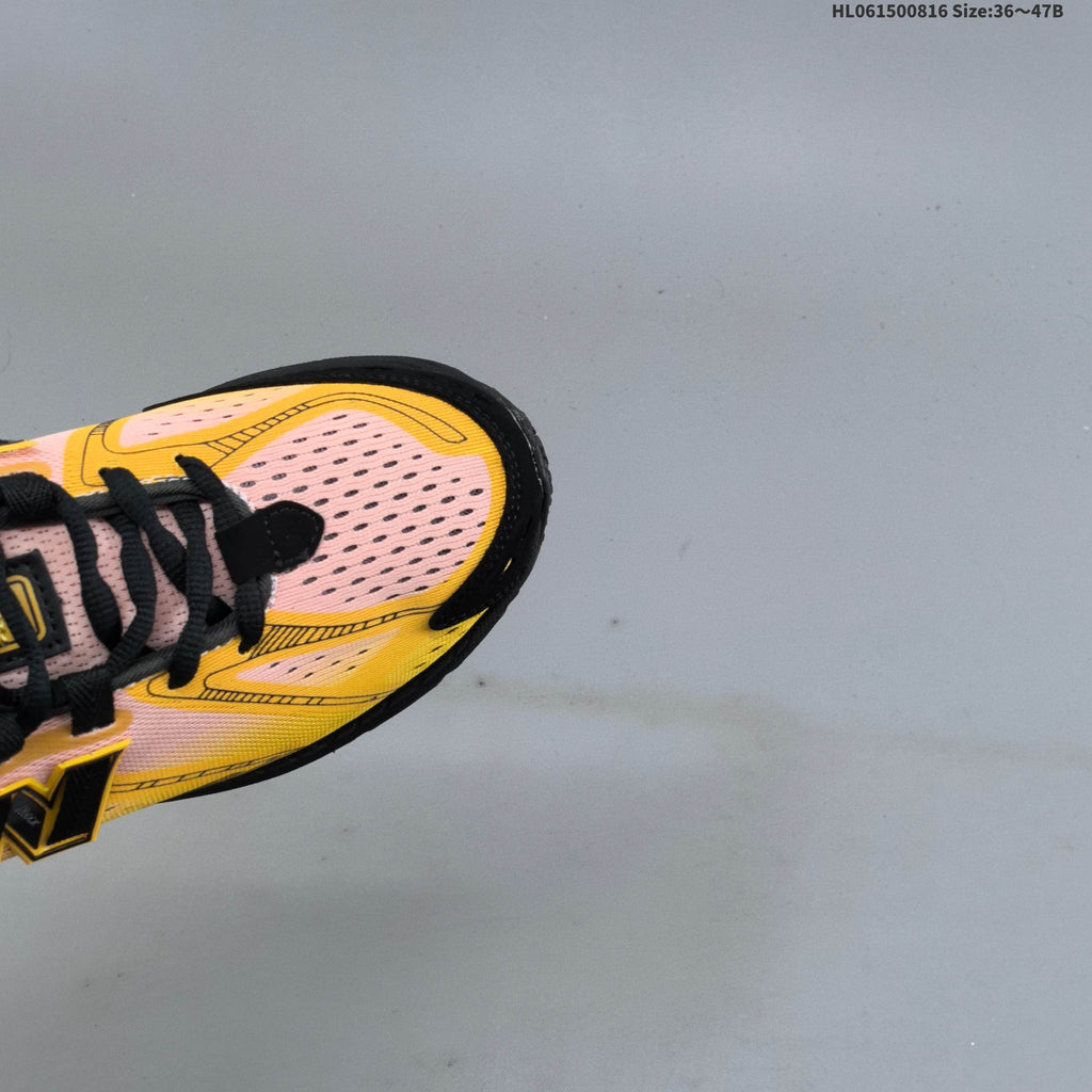 New Balance M1906R Sneakers in Pink Yellow Black U1906596 - product image from the listing.
