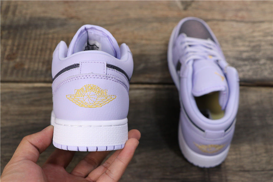 Air Jordan 1 Low GS Oxygen Sneakers in Purple 554723-505 - product image from the listing.